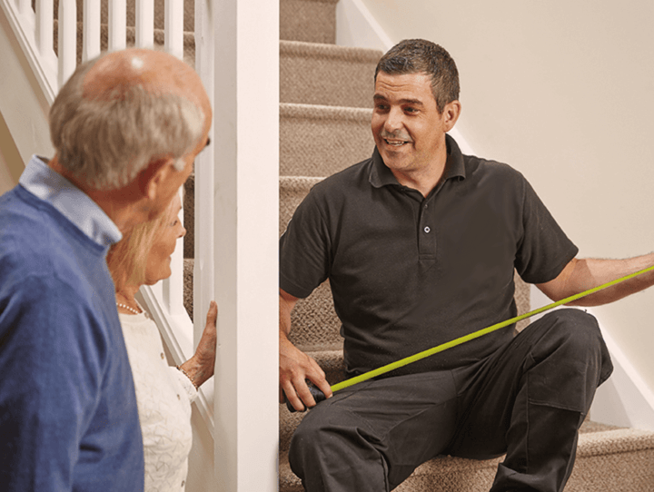 installer helping provide measurements and Stairlift Service